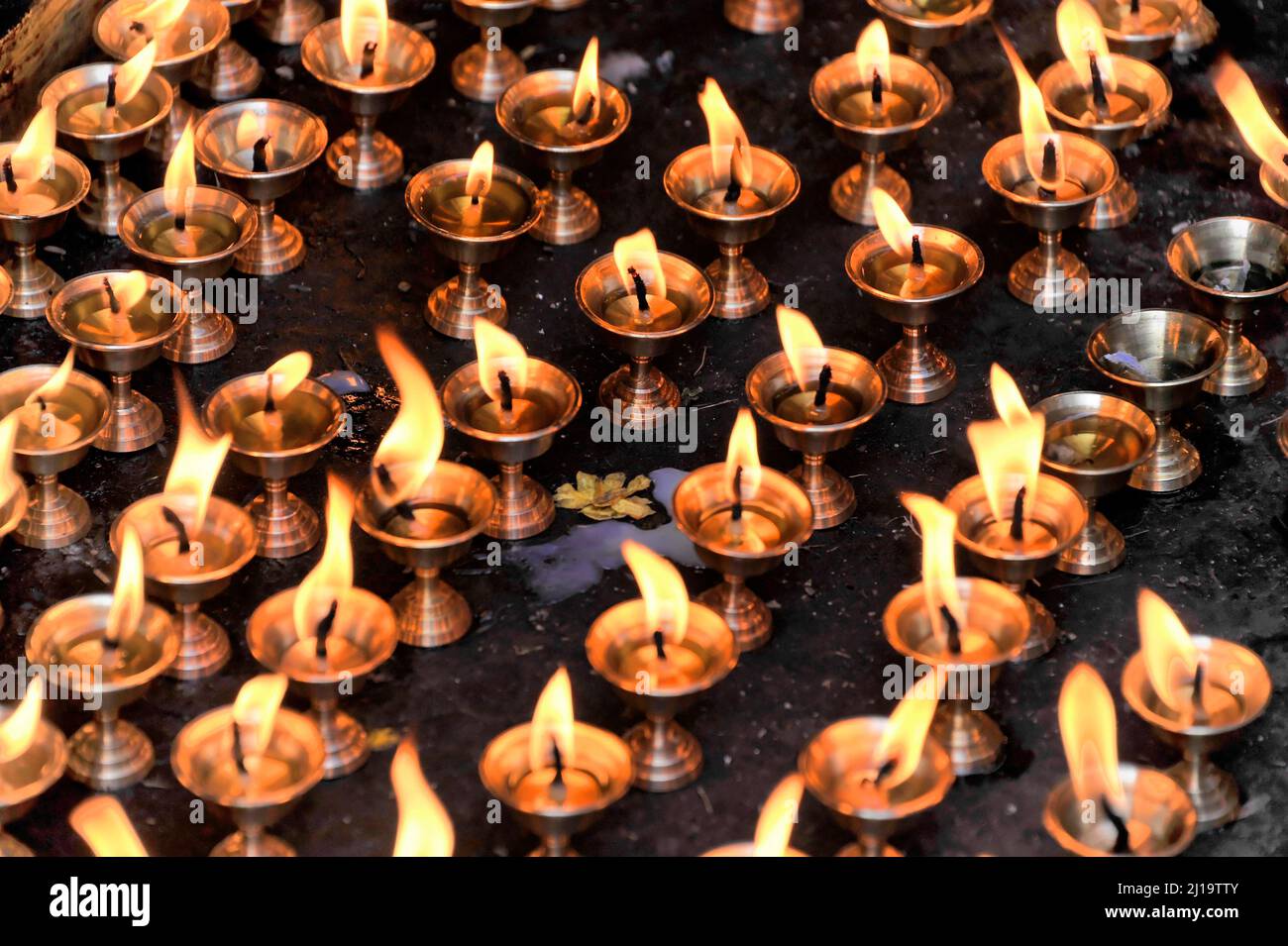 Worshippers light butter lamps, candles, fires for religious ceremonies