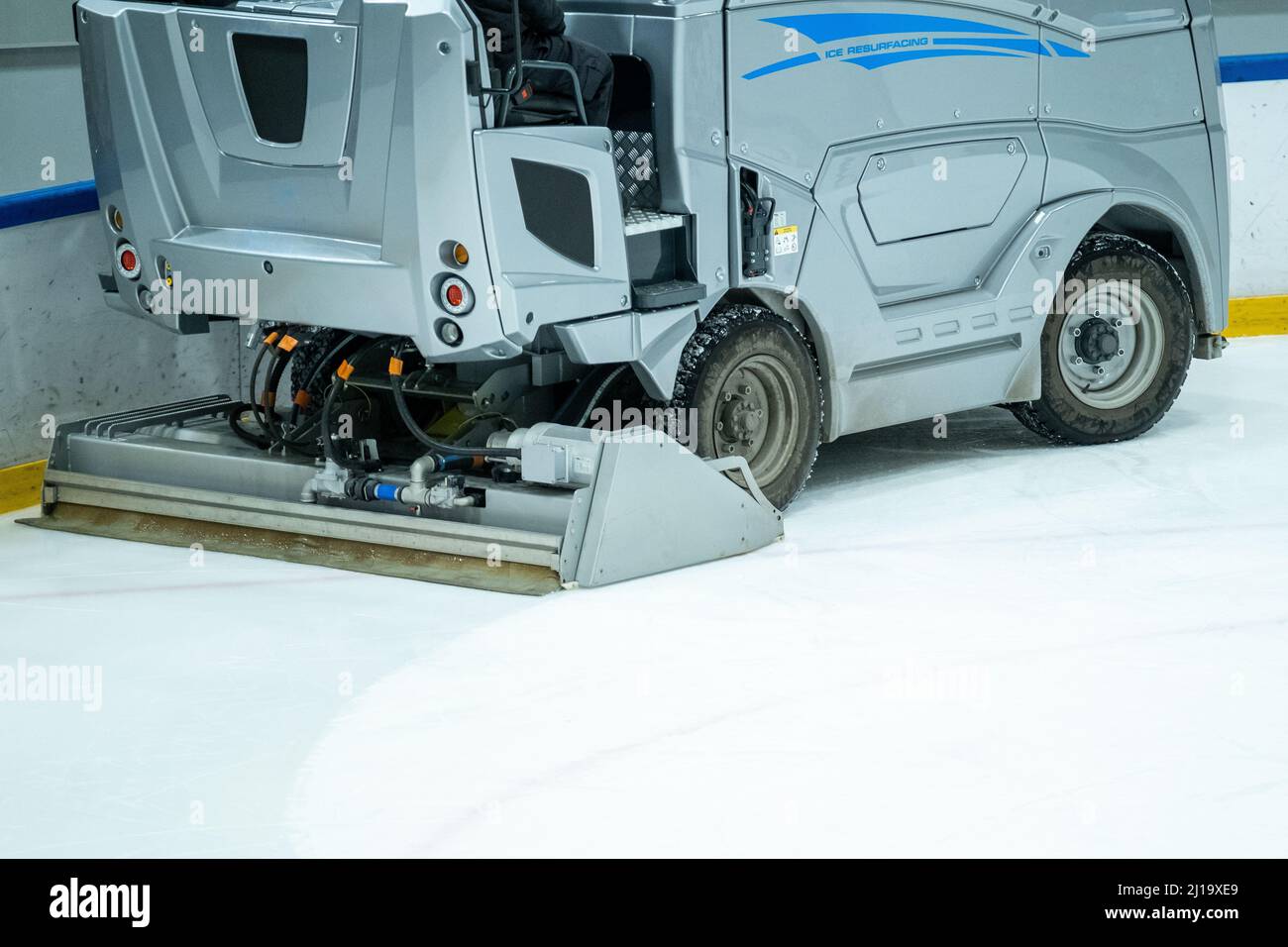 Helsinki / Finland - MARCH 22, 2022: Closeup of electric operated Ice resurfacer machine cleaning the ice surface Stock Photo