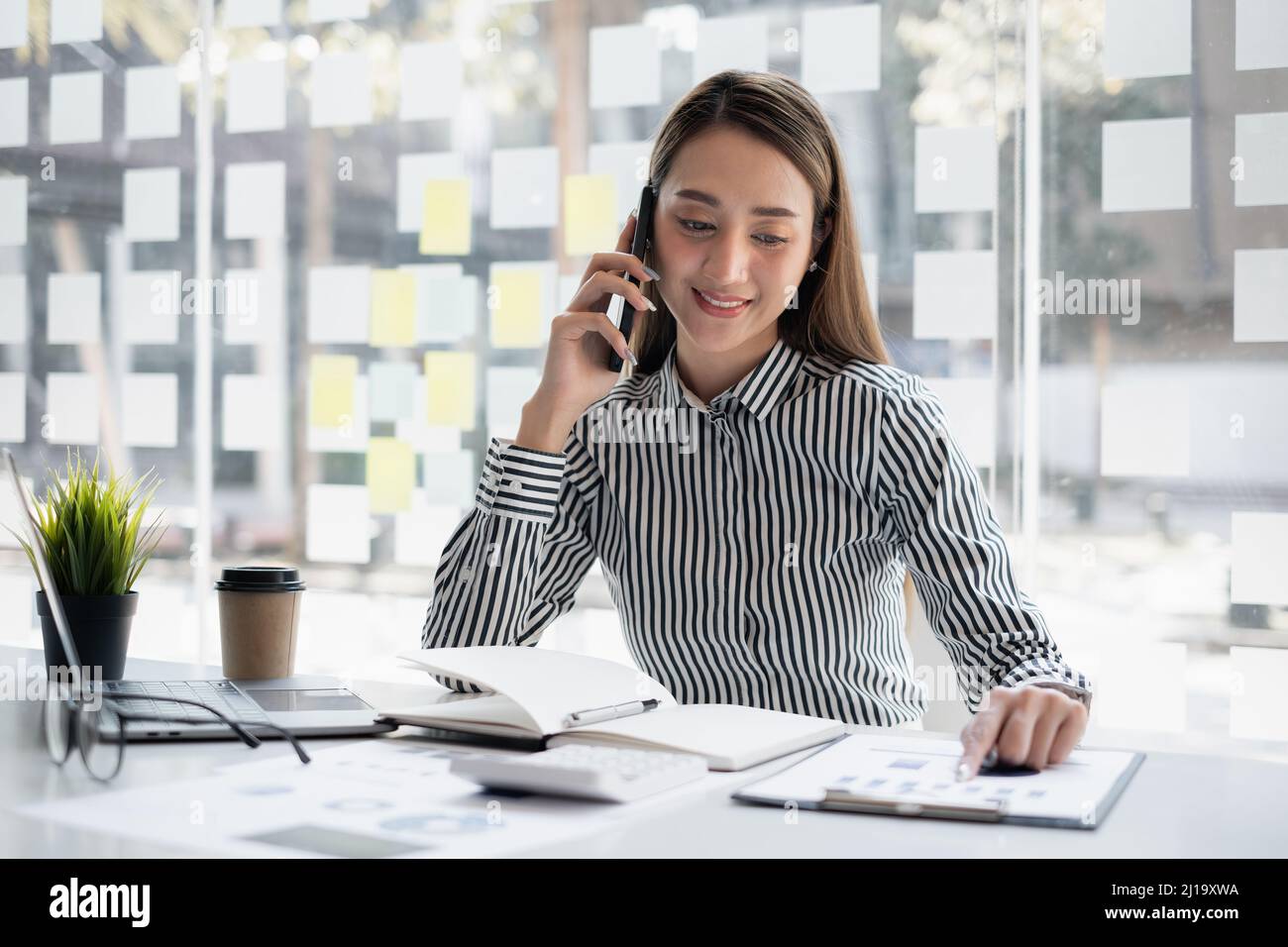 Business woman discuss with partners talking by cell phone. Female