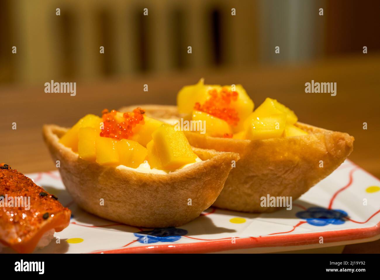 A classic and delicious Japanese dish, mango tofu skin sushi Stock