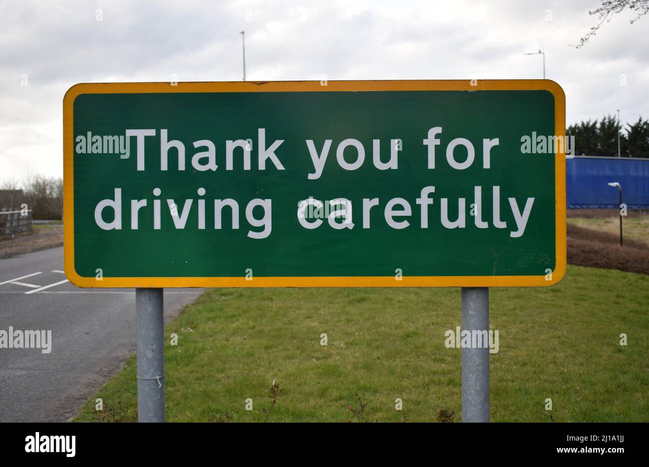 Sign at the roadside: 'Thank you for driving carefully'. Stock Photo