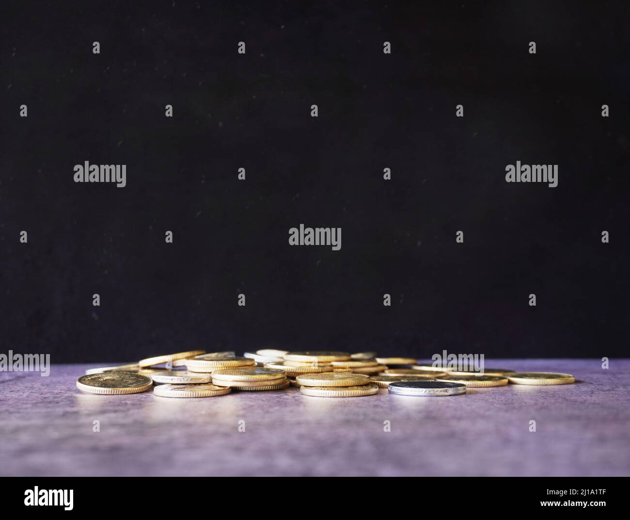Black Board and Coins on the floor . Stock Photo Stock Photo