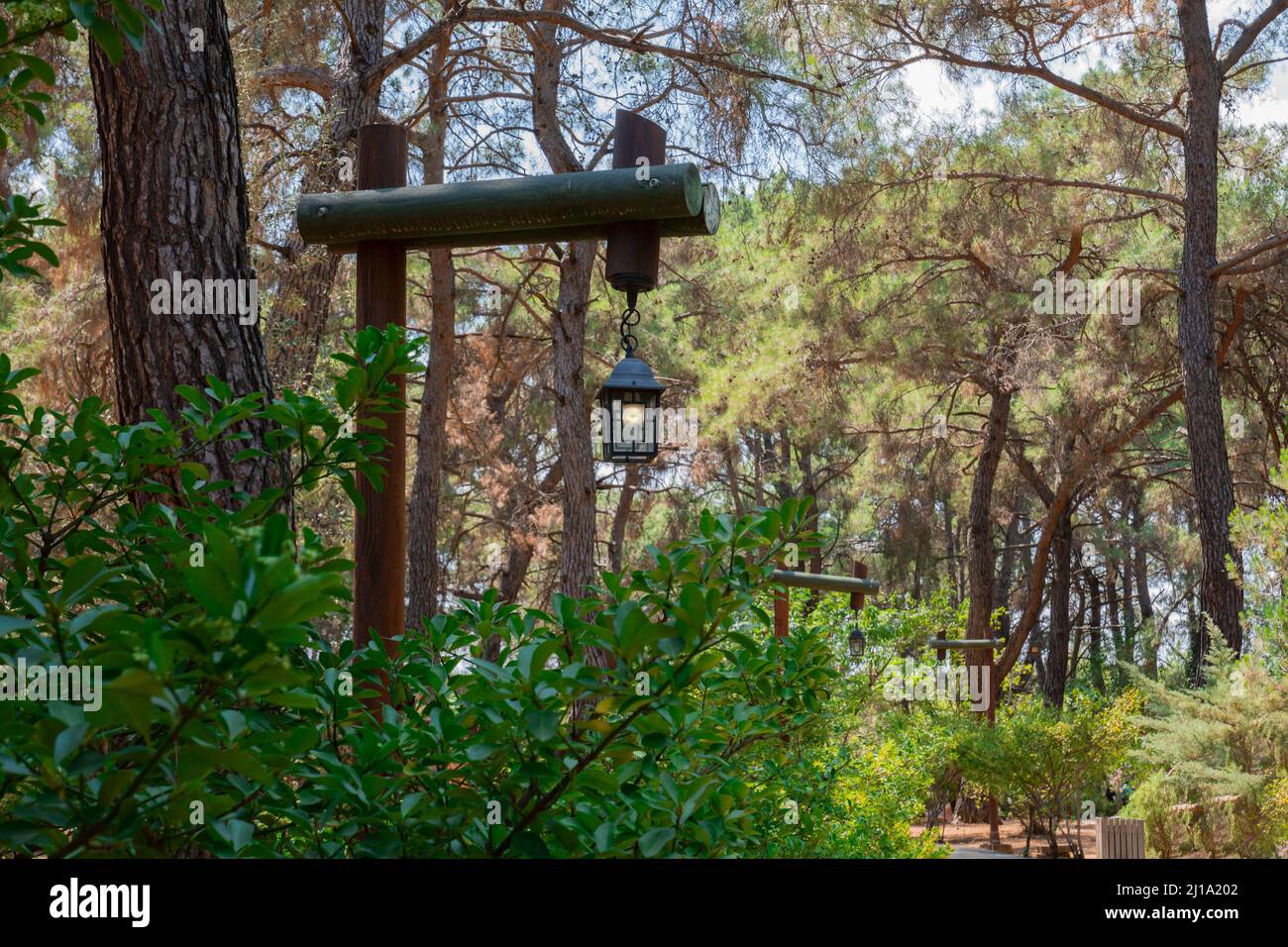 The Kursunlu Waterfall Nature Park is on one of the tributaries of the Aksu River and situated in the midst of a pine forest.decorative wooden street Stock Photo