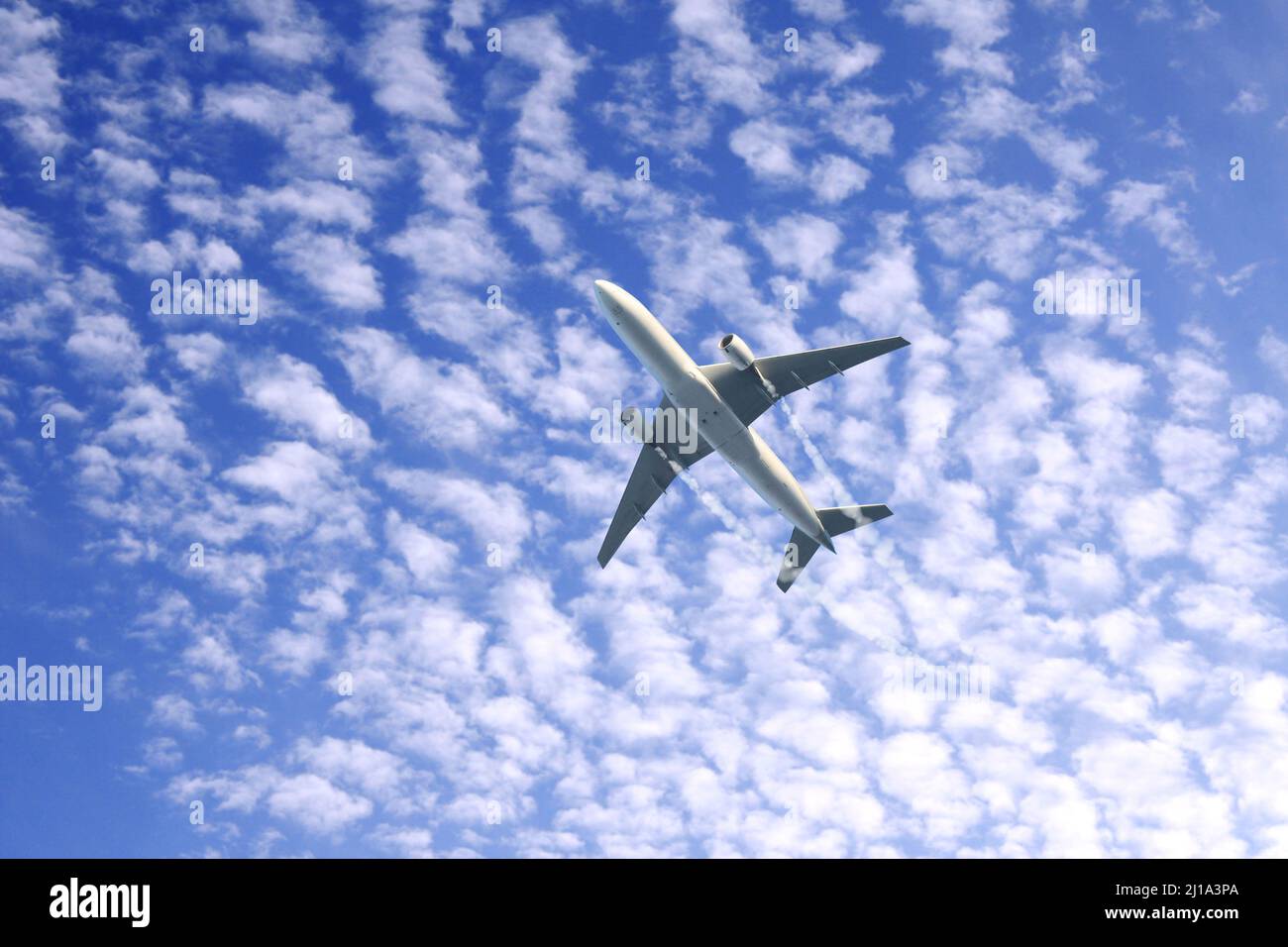 Vertical nature background with aircraft and Jet trailing smoke in the ...
