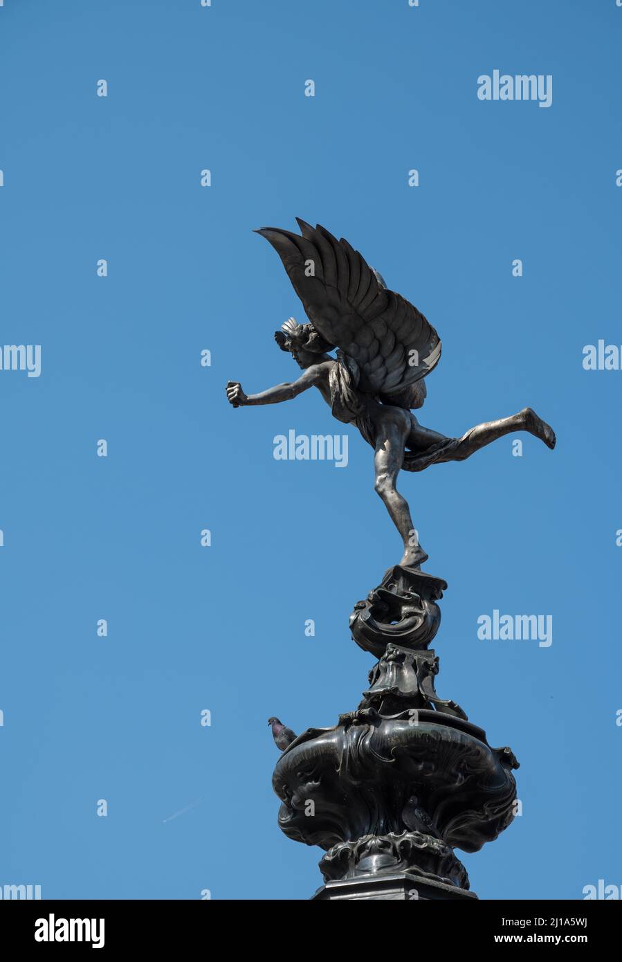 Incorrectly known as Eros, the winged statue of Anteros, with bow missing, atop the Shaftesbury Memorial Fountain. Piccadilly Circus, London, England Stock Photo