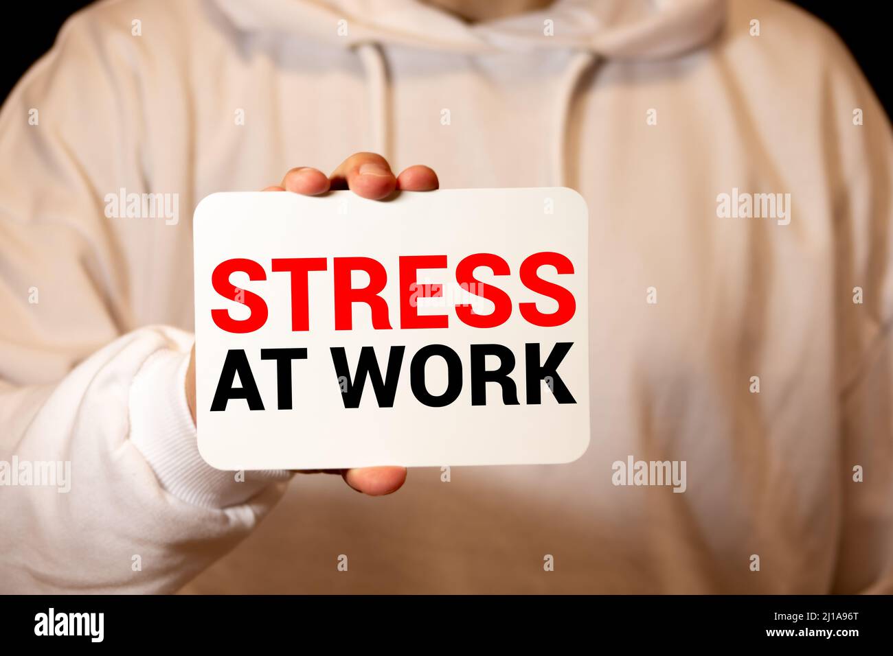 Concept conceptual mental stress at workplace or job abstract word cloud in hand isolated on background metaphor to health, work, depression, problem, Stock Photo
