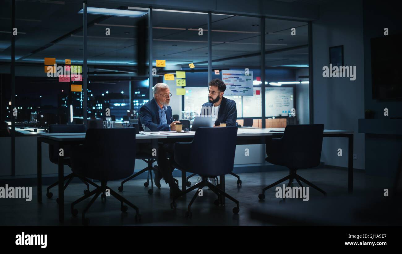 Businesspeople in Modern Office: Business Meeting of Two Managers. CEO and Operations Director Talk; Discuss; Brainstorm Corporate Strategy; Implement Stock Photo
