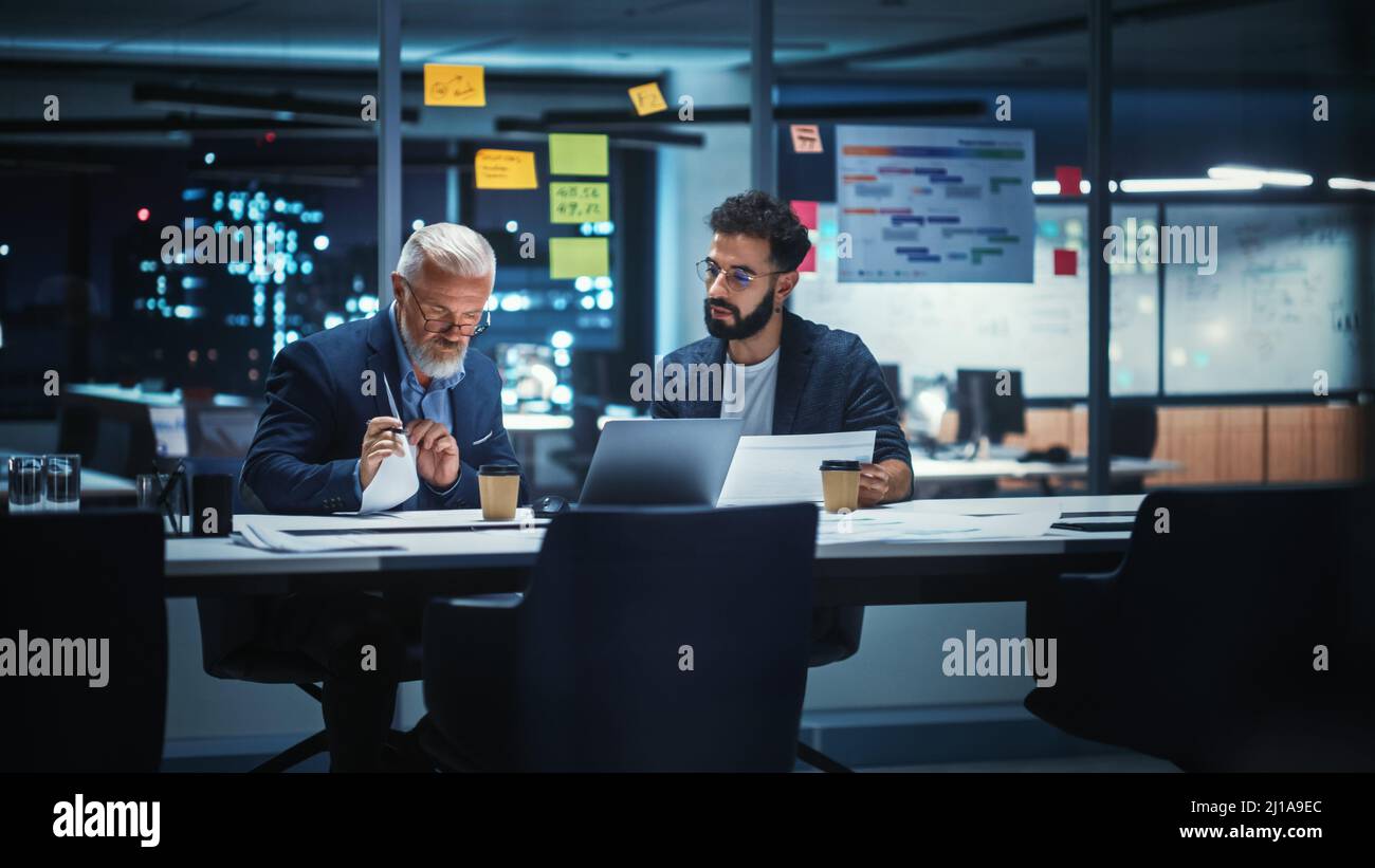 Businesspeople in Modern Office: Business Meeting of Two Managers. CEO and Operations Director Talk; Discuss; Brainstorm Corporate Strategy; Implement Stock Photo