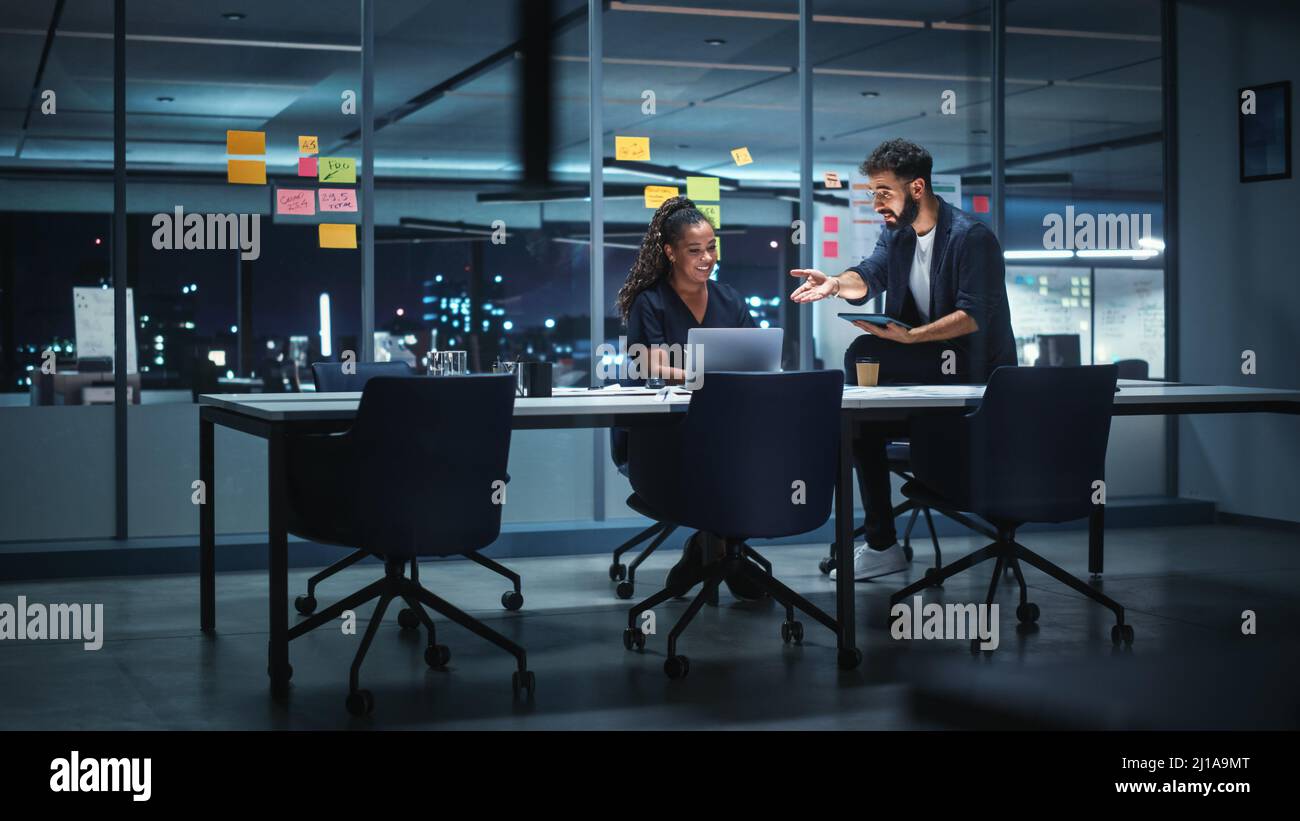 Businesspeople in Modern Office: Business Meeting of Two Managers. Female CEO and Marketing Director Talk; Brainstorm Corporate Strategy; Implementing Stock Photo