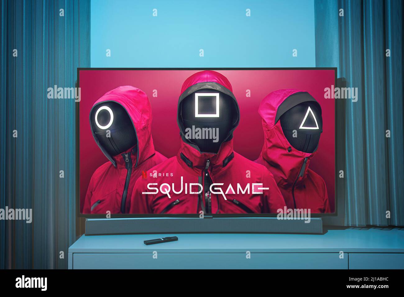 Squid game TV series on big tv screen. Squid game television show at home Stock Photo