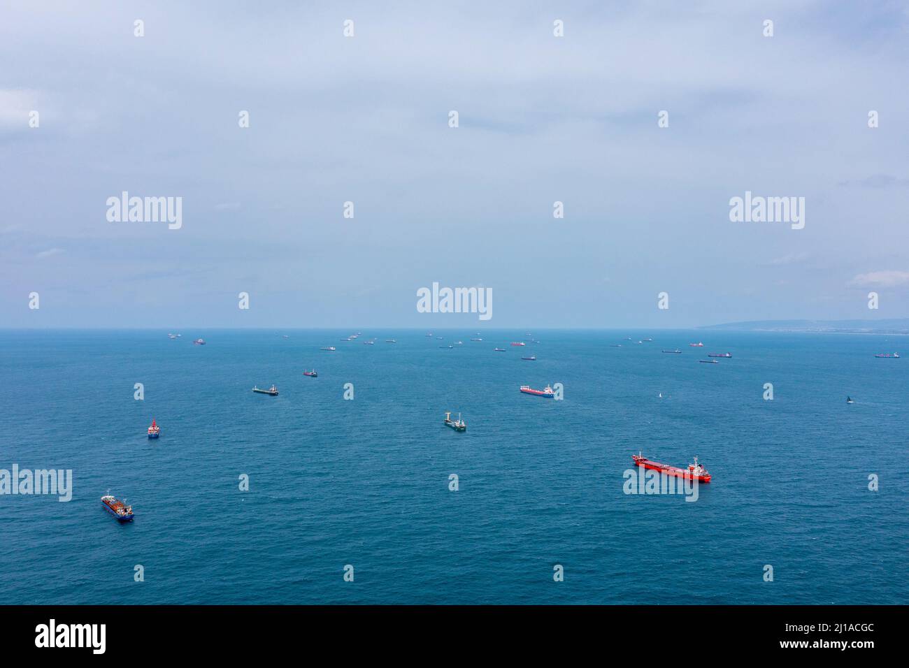 Fifty Cargo and Container ships anchored close to port due to worldwide Maritime congestion crisis, Aerial view. Stock Photo