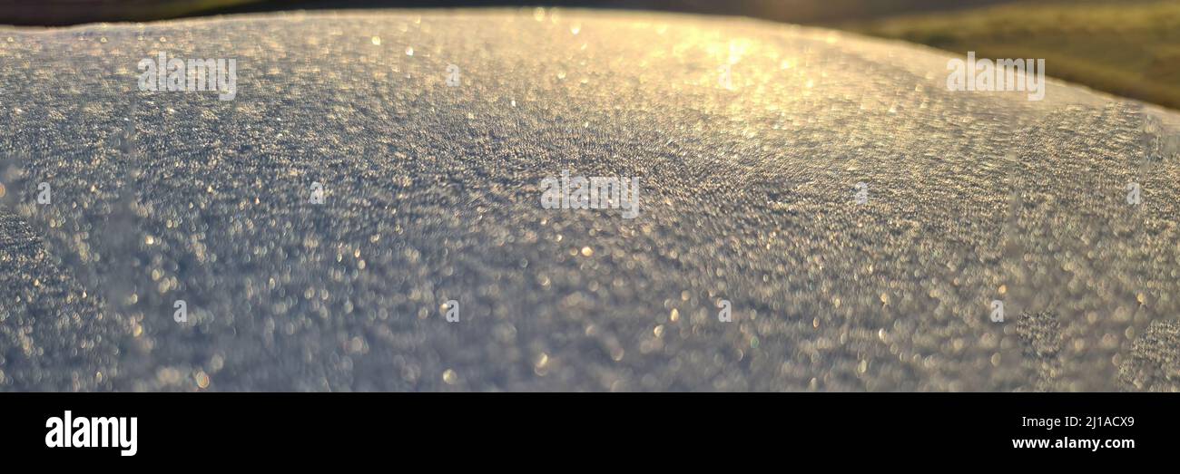 Bright sunlight on white frosty surface background Stock Photo