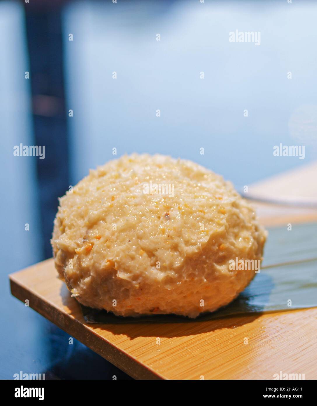 Raw mashed crab roe paste fish ball for hot pot on bamboo plate Stock Photo