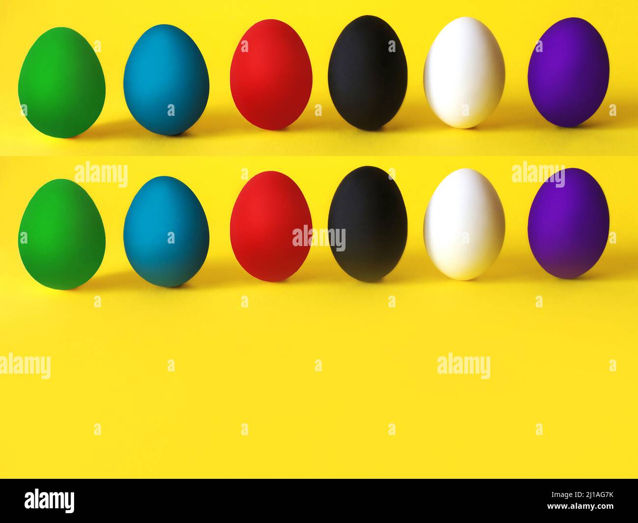 Colorful eggs on the yellow background. Black lives matter, all lives matter, diversity, equal rights concept Stock Photo
