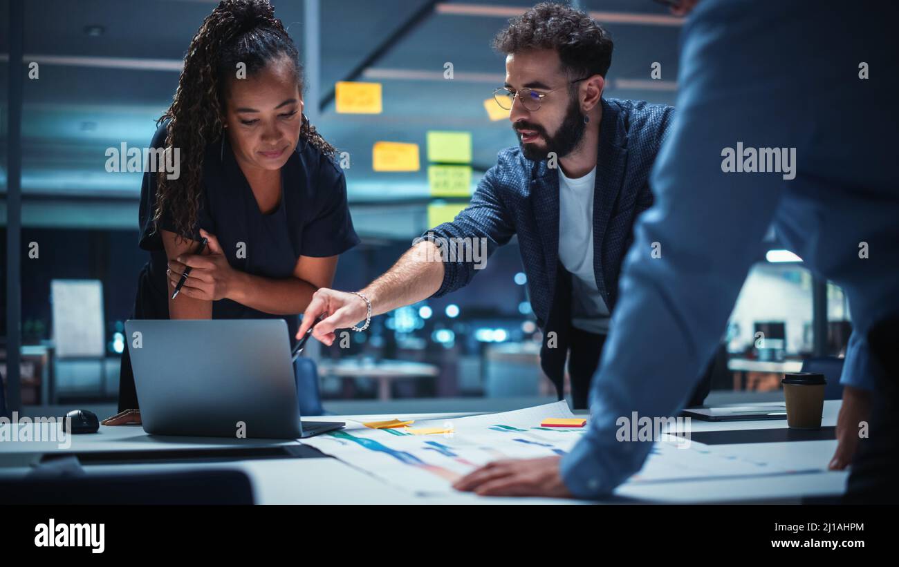 Office Conference Room Meeting: Diverse Team of Top Managers Talk; Brainstorm; Use Digital Tablet. Business Partners Discuss Financial Reports; Plan I Stock Photo