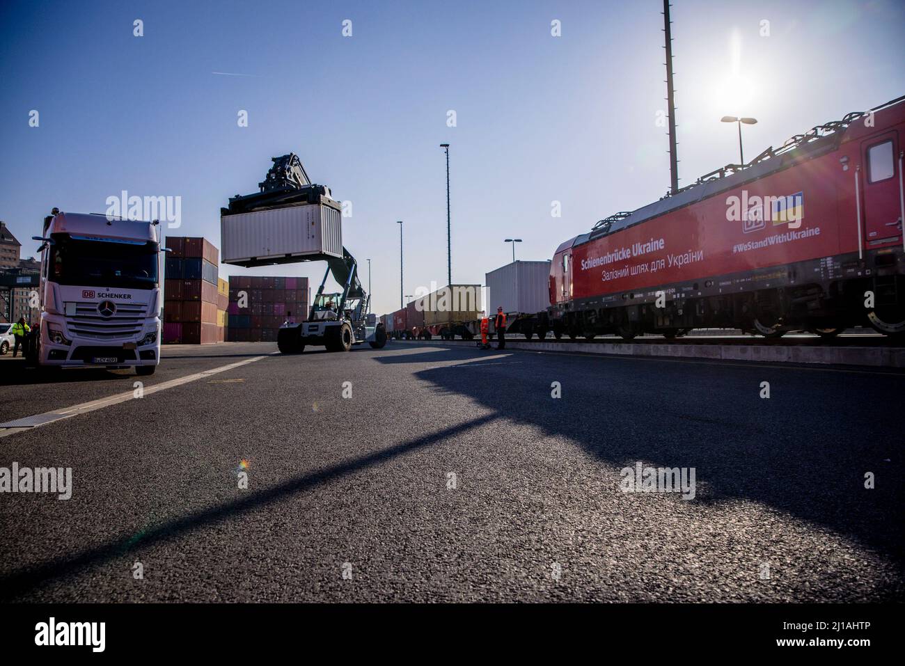 Container Train Db Berlin, Germany. 24th Mar, 2022. Workers load containers onto a train ...