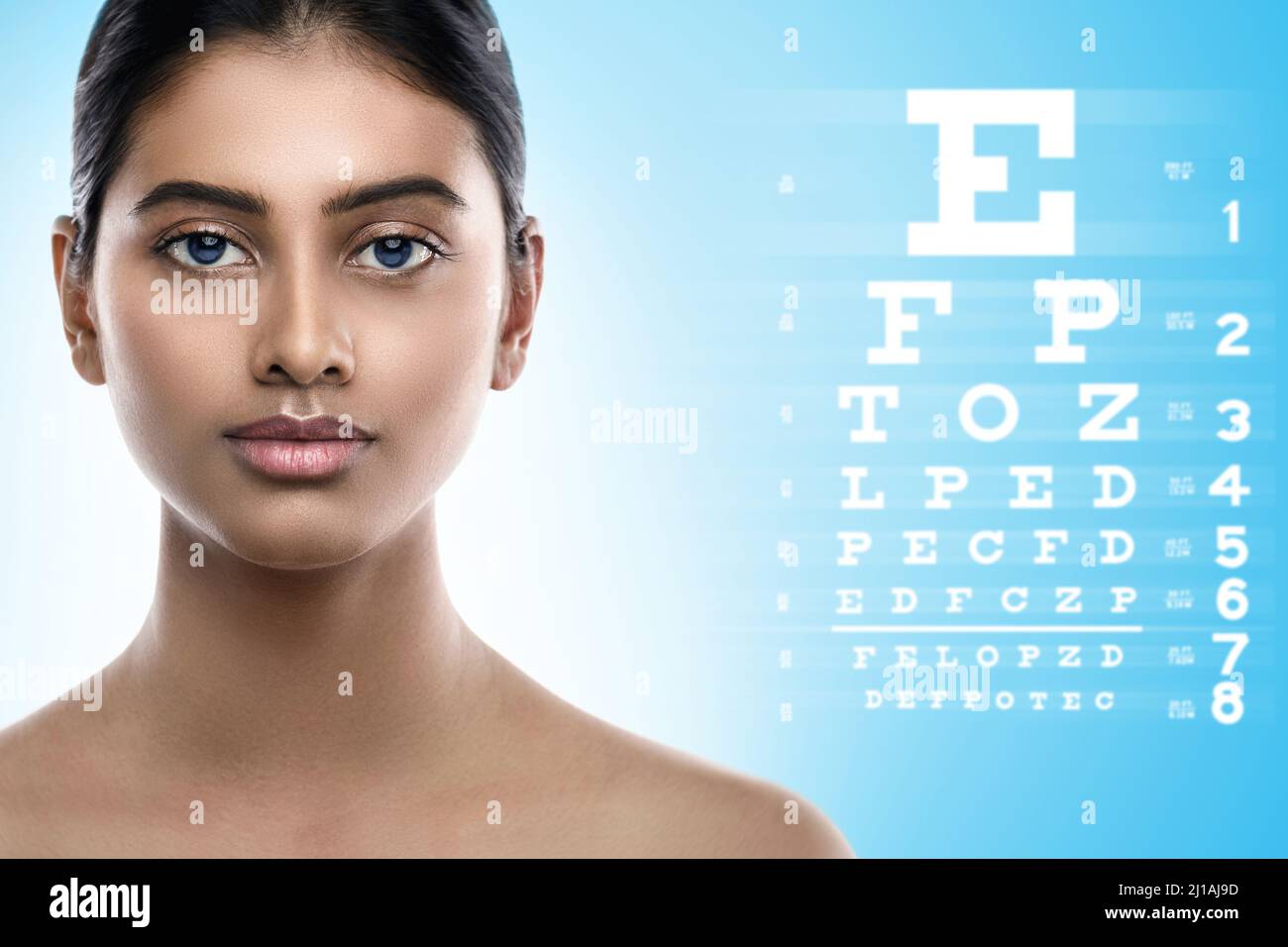 Indian woman and eye chart for sight test Stock Photo Alamy