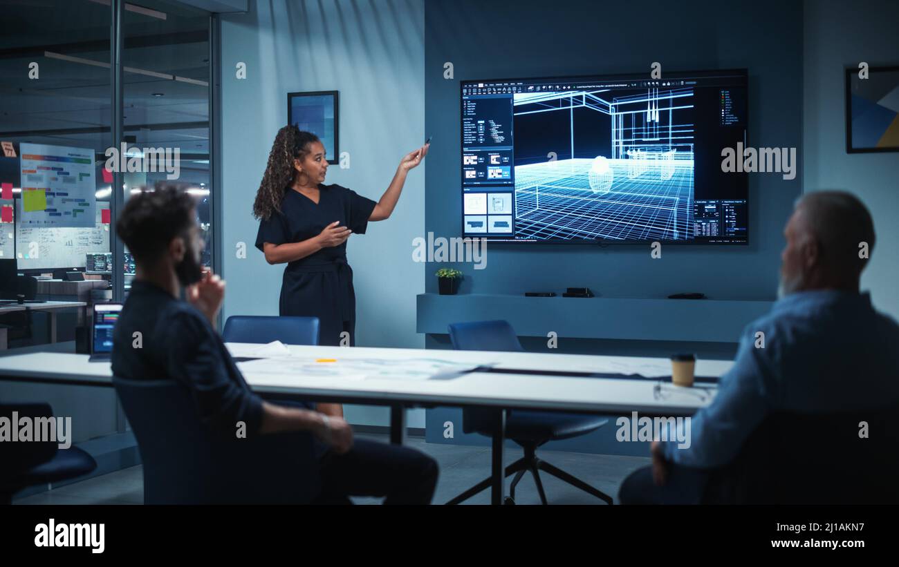 Creative Architect Holds Meeting Presentation of a New Housing Project for a Team of Real Estate Investors. Adult Male Uses TV Screen with Technical D Stock Photo
