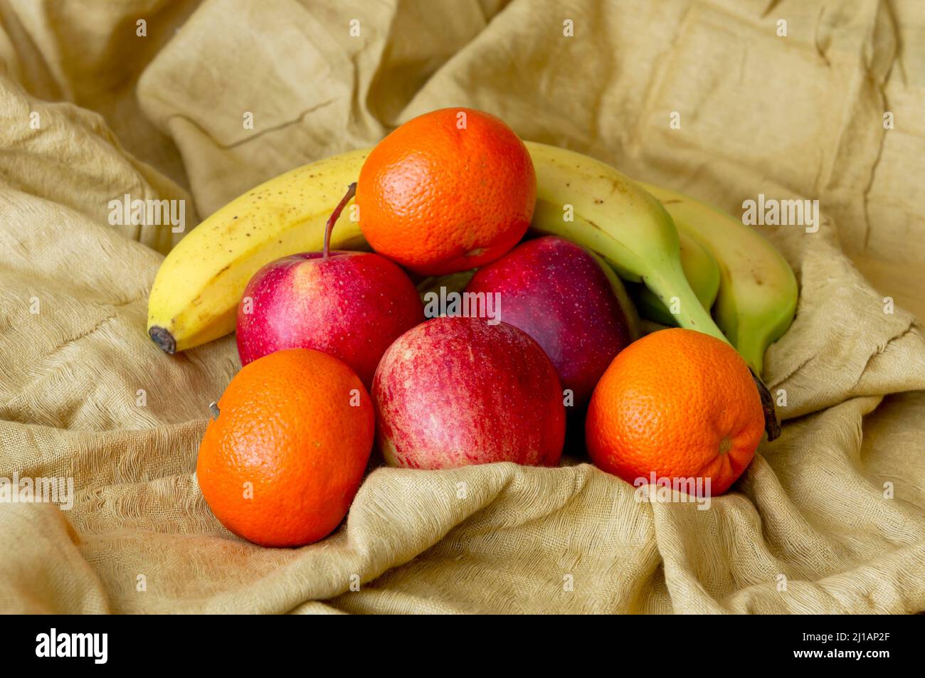 Bananas, apples and oranges on a cloth Stock Photo Alamy