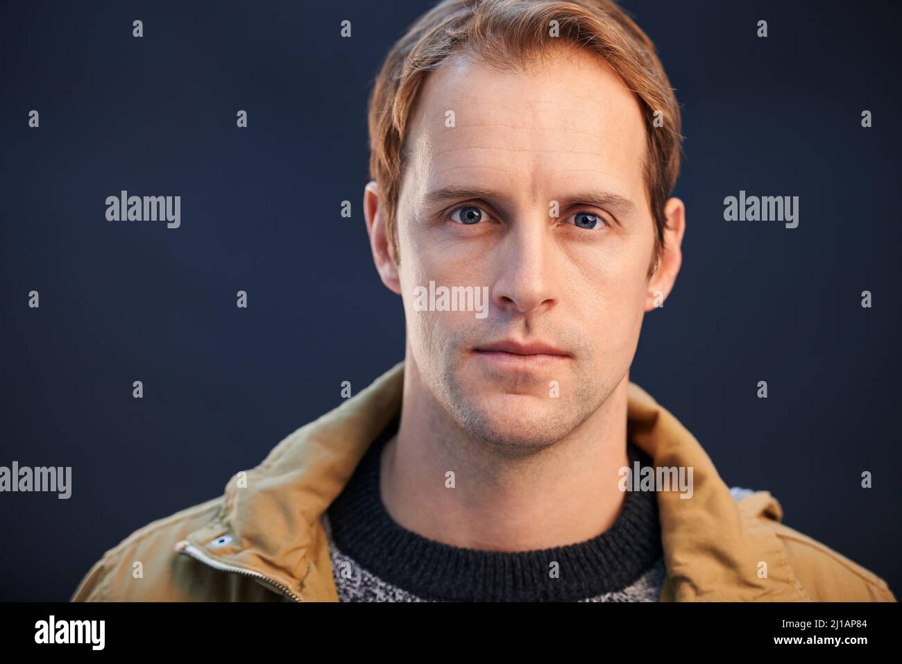 Yes, hes serious. A cropped studio shot of a handsome man looking serious. Stock Photo