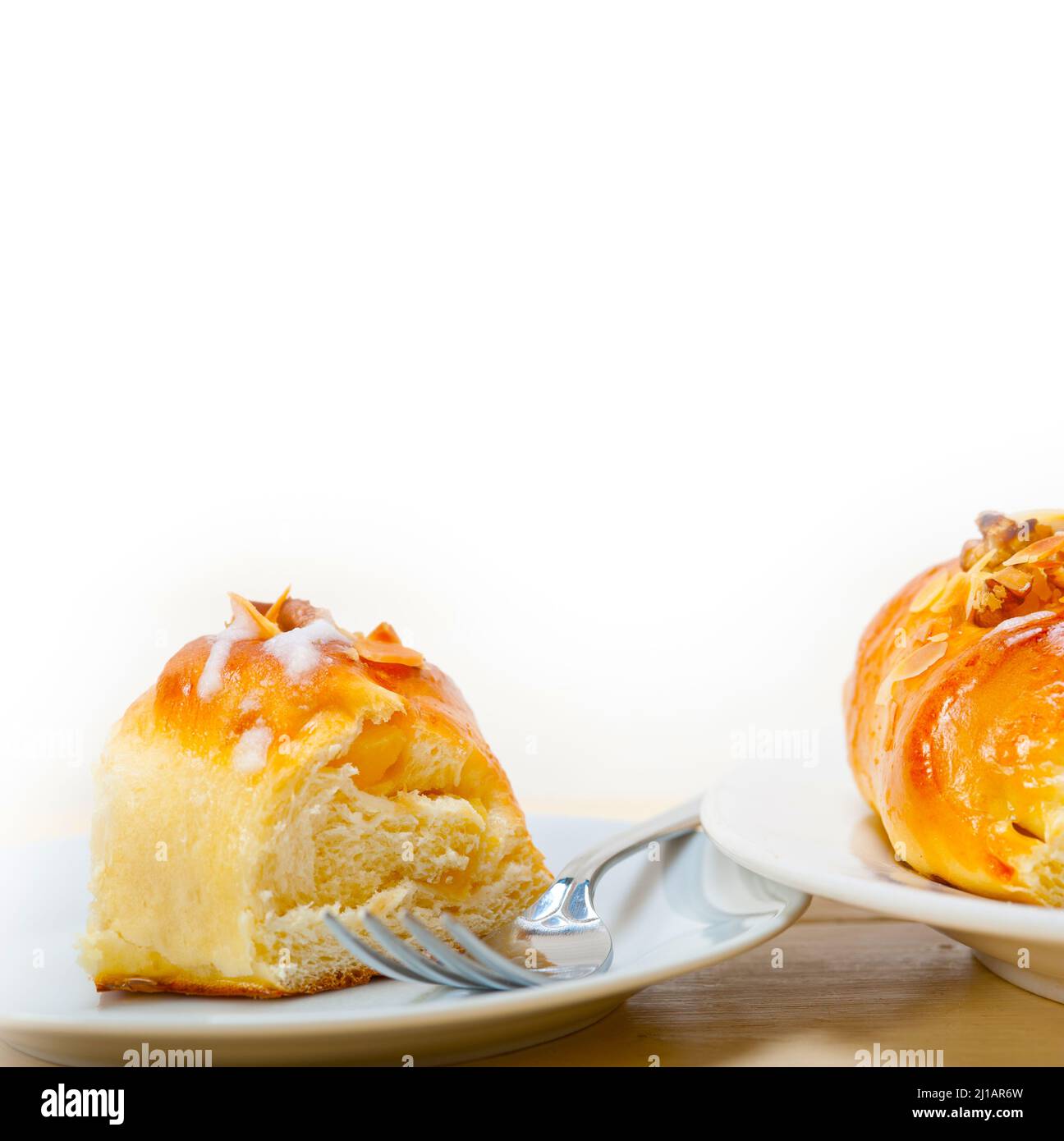 fresh home baked sweet bread donut cake with almonds and icing sugar on top Stock Photo