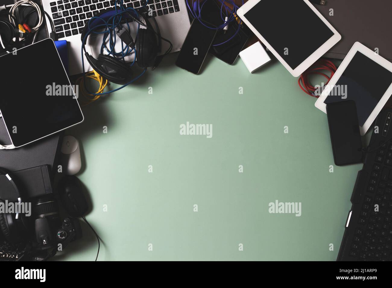 Top view to old laptop computers, digital tablets, mobile phones, many