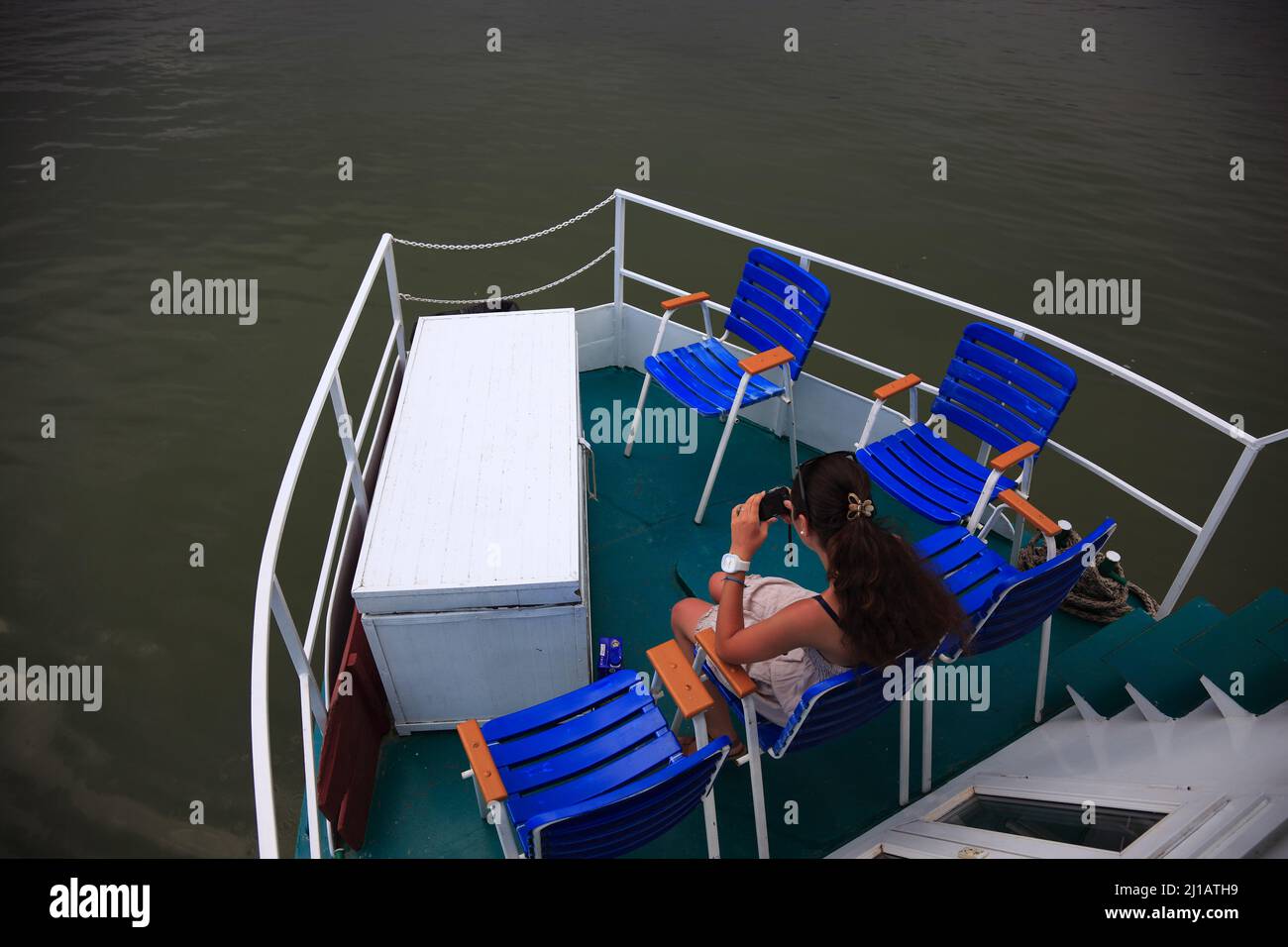 Touristin auf einem Ausflugsboot im Biosphärenreservat Donaudelta, bei Tulcea, Rumänien  /  Tourist on a tour boat in the Danube Delta Biosphere Reser Stock Photo