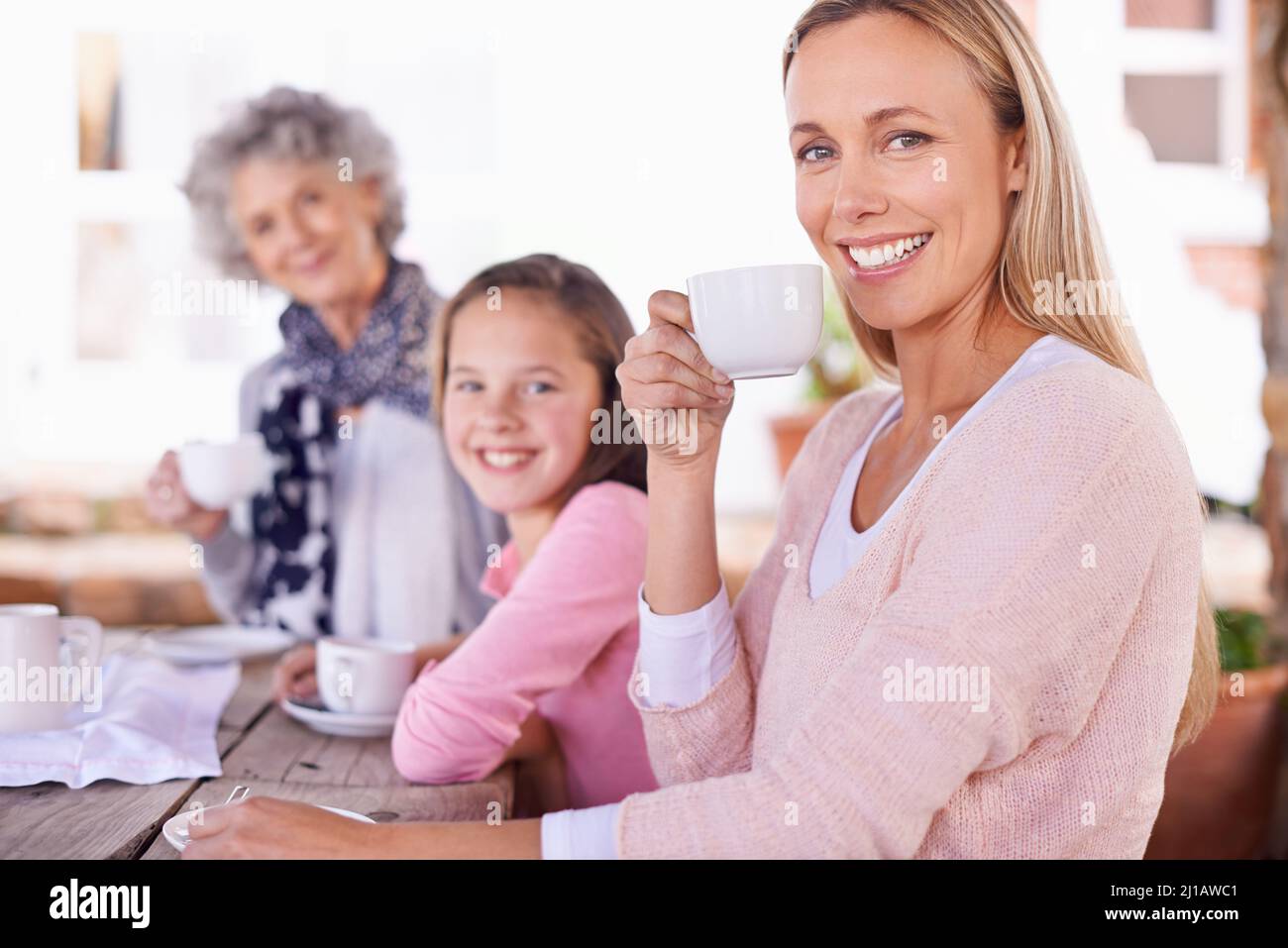 Girls time only. Shot of three generations of the woman of the women of a family having tea outside. Stock Photo