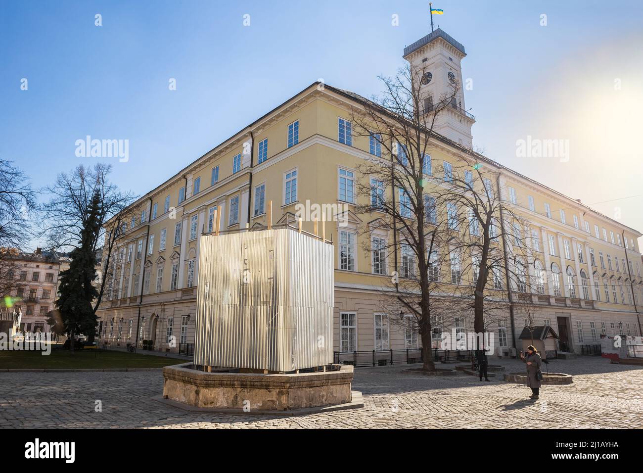 LVIV, UKRAINE - March 17, 2022: One of the statues near the City Hall in Lviv is shielded to prevent damaging during possible bombardment. Russia inva Stock Photo
