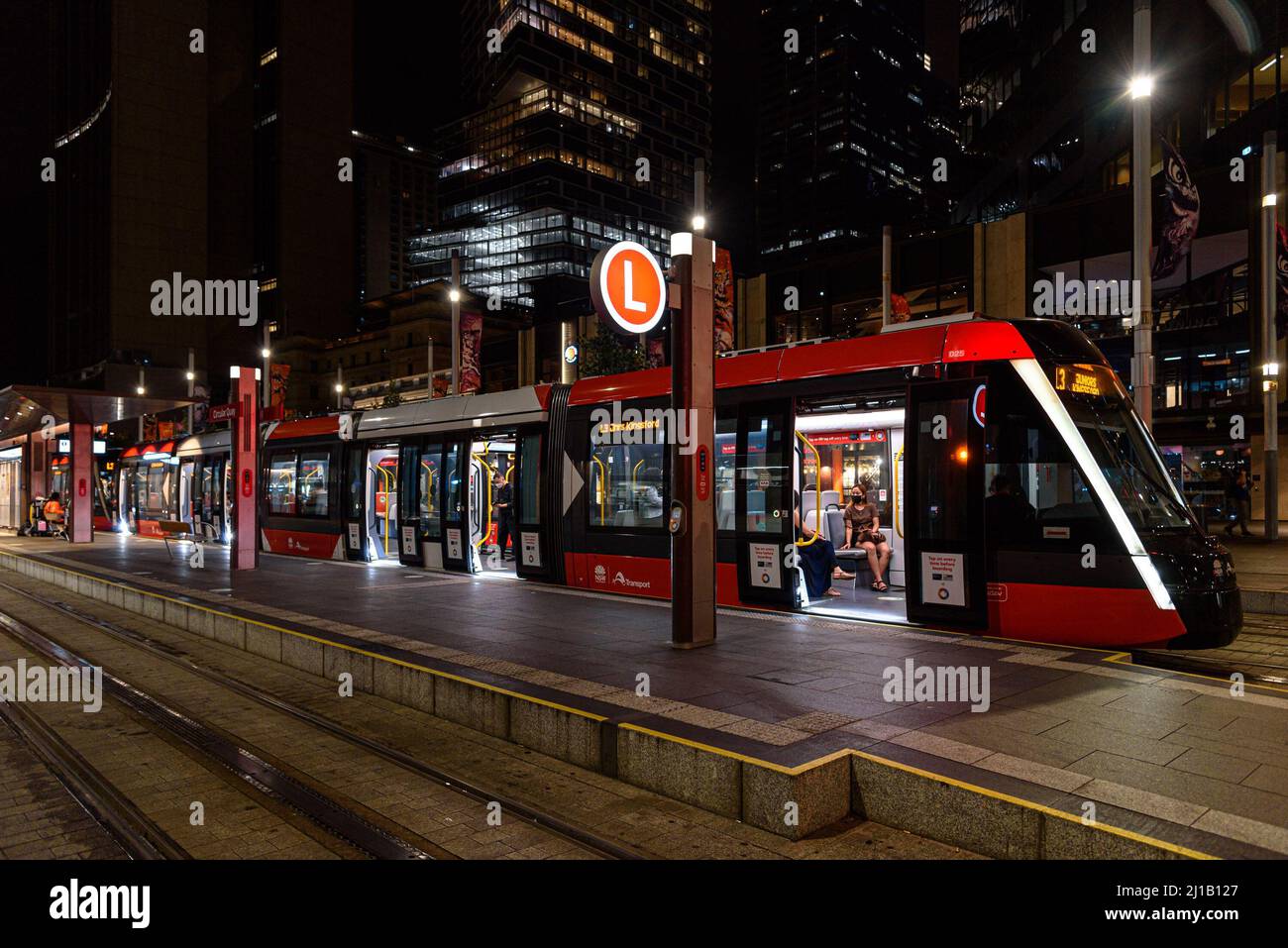 An L3 tram waiting at the Circular Quay stop in Sydney at night Stock