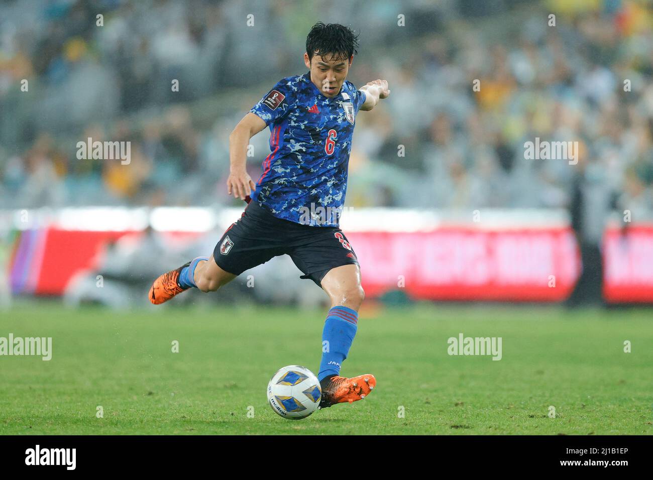 Sydney, Australia. 24th Mar, 2022. Wataru Endo of Japan shoots during the FIFA World Cup 2022 Qualifier match between Australia and Japan at Accors Stadium, Sydney, Australia on 24 March 2022. Photo by Peter Dovgan. Editorial use only, license required for commercial use. No use in betting, games or a single club/league/player publications. Credit: UK Sports Pics Ltd/Alamy Live News Stock Photo