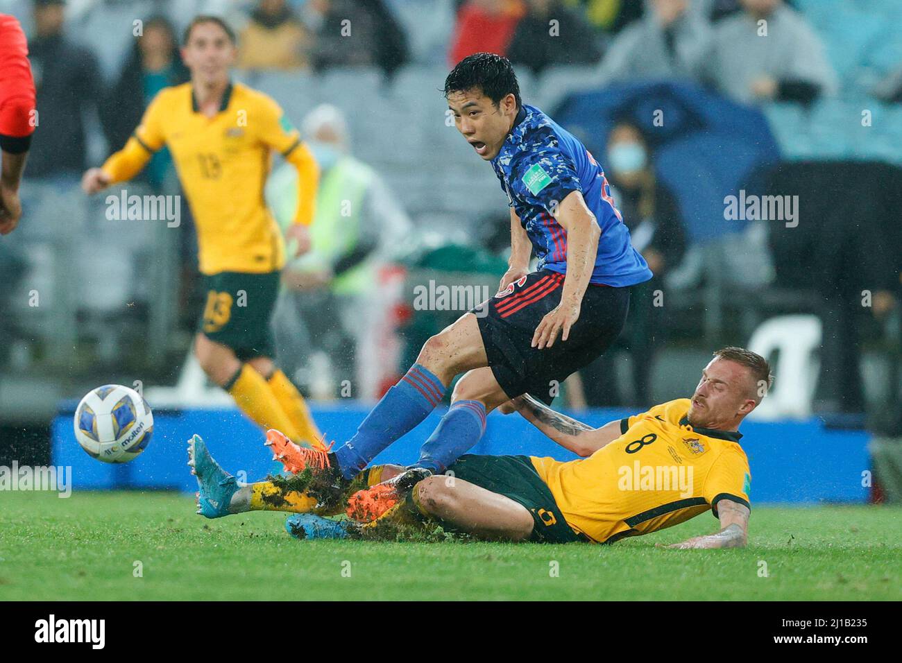 Sydney, Australia. 24th Mar, 2022. James Jeggo of Australia tackles Wataru Endo of Japan during the FIFA World Cup 2022 Qualifier match between Australia and Japan at Accors Stadium, Sydney, Australia on 24 March 2022. Photo by Peter Dovgan. Editorial use only, license required for commercial use. No use in betting, games or a single club/league/player publications. Credit: UK Sports Pics Ltd/Alamy Live News Stock Photo