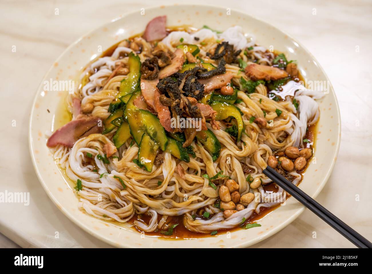 Sweet and sour and delicious Guangxi Nanning traditional dish, sweet and sour barbecued pork dry noodles Stock Photo