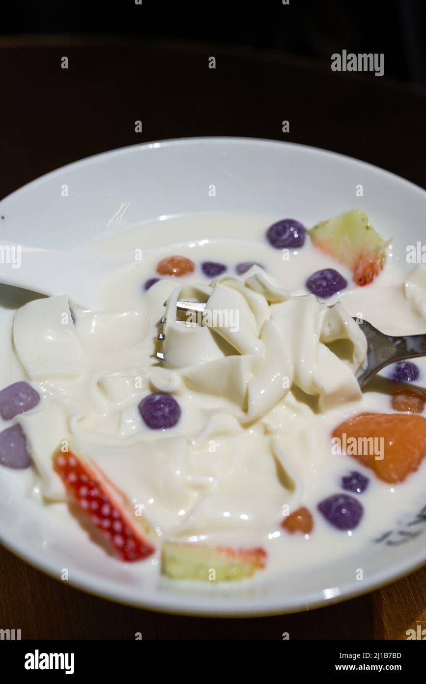 Fragrant and sweet Southeast Asian dessert, coconut milk and fruit taro