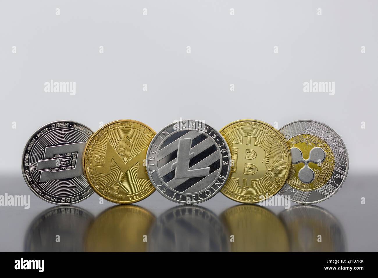 Cryptocurrency five coins litecoin LTC, Bitcoin BTC, Monero XMR, Dash abd  Ripple XPR lined up together Stock Photo - Alamy