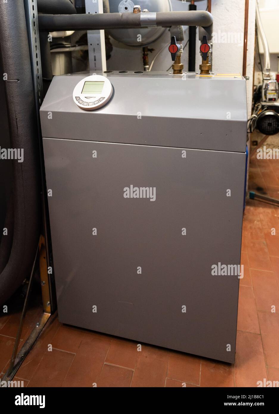 24 March 2022, Baden-Wuerttemberg, Rottweil: An air-source heat pump is located in the basement of a residential building. The heat pump is considered the environmentally friendly and future-proof alternative to oil and gas heating. Photo: Silas Stein/dpa Stock Photo