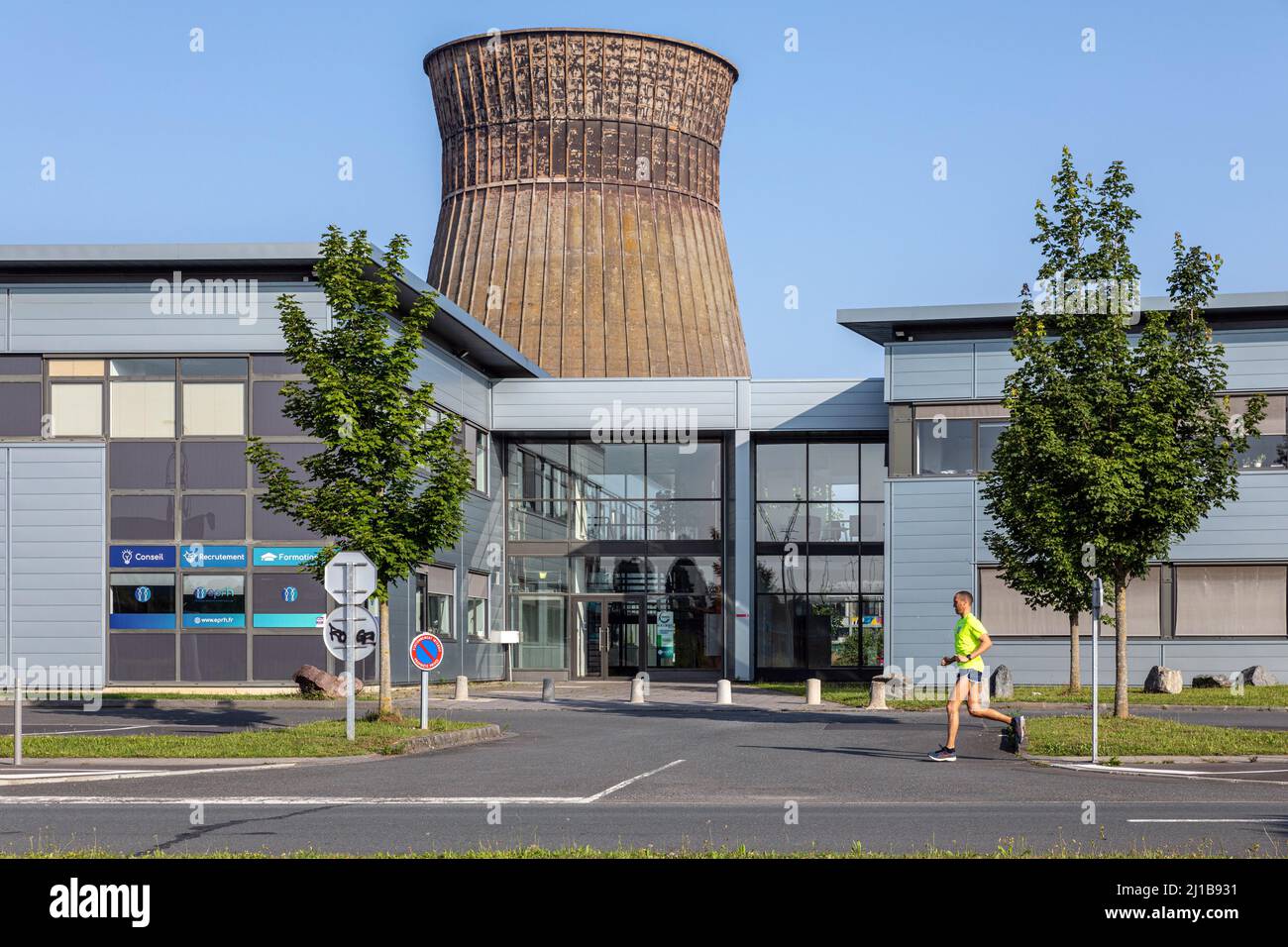 NORMANDIAL SMALL-BUSINESS PARK ON THE SITE OF THE FORMER METALLURGICAL CORPORATION OF NORMANDY (SMN) WHERE A COOLING TOWER STILL STANDS, CAEN, COLOMBELLES, CALVADOS, NORMANDY, FRANCE Stock Photo