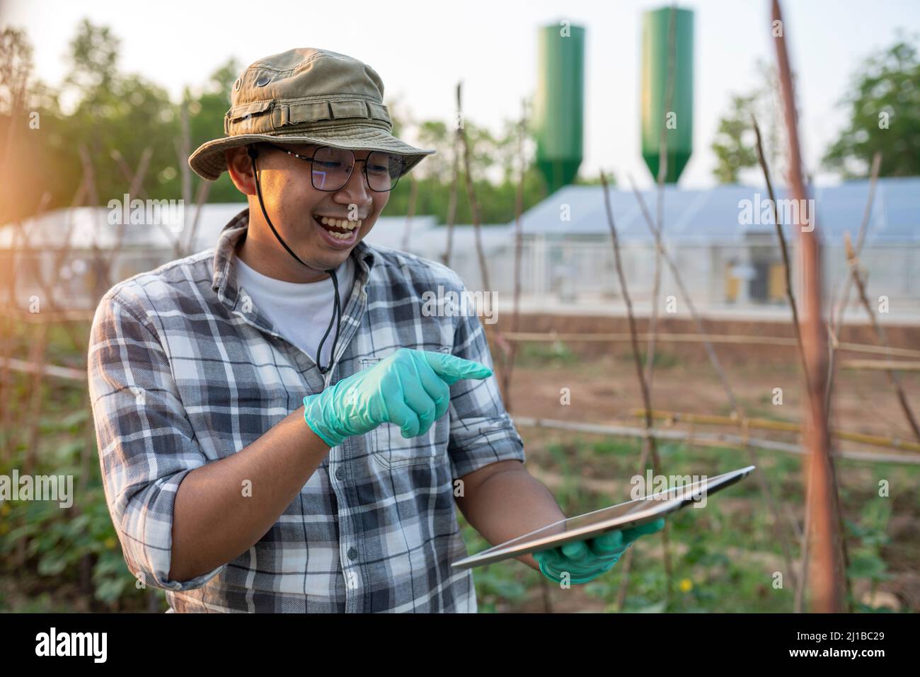 successful smiling of young gardener enjoying with hobby of him Stock Photo