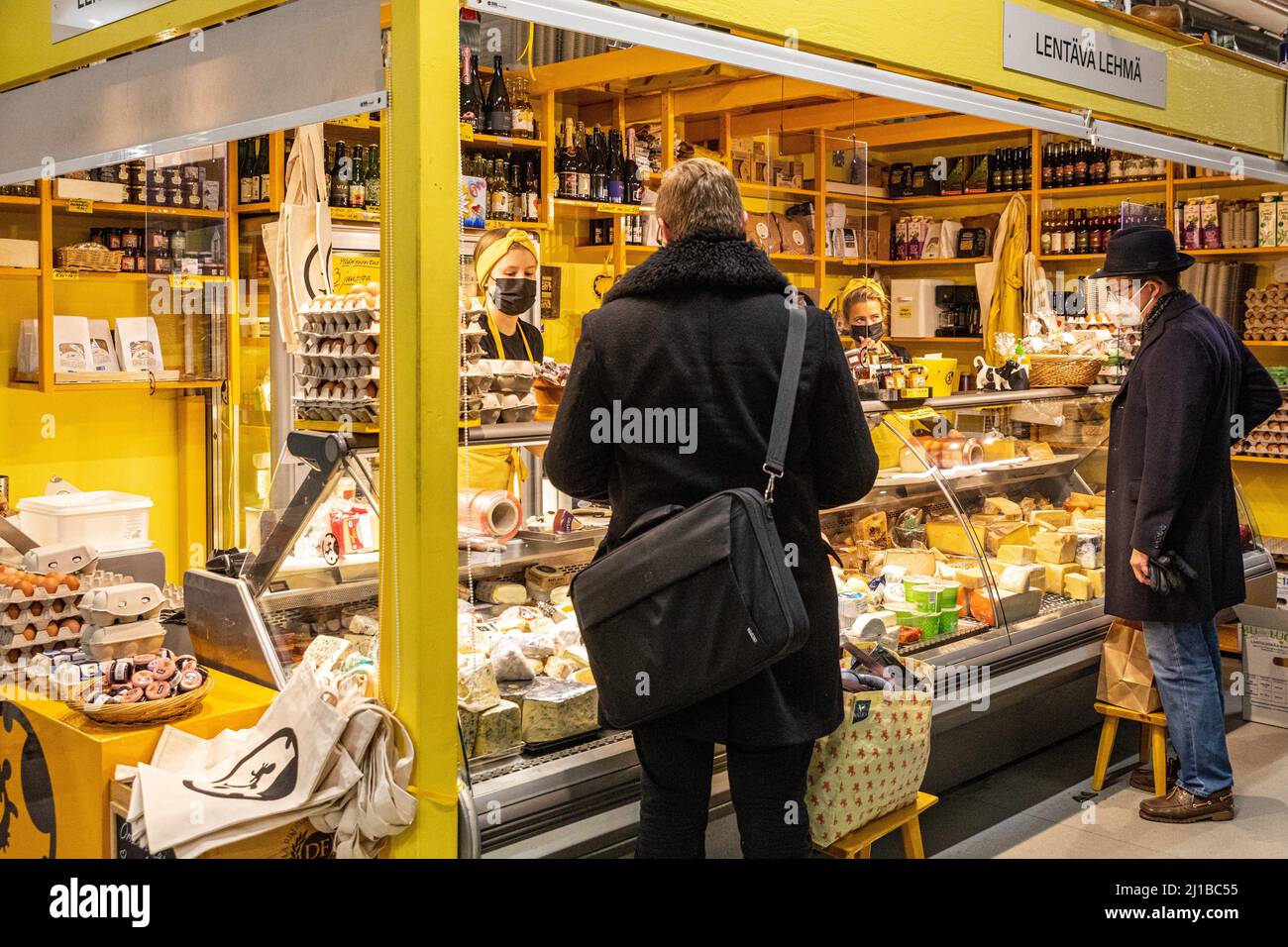 CHEESE SELLER IN THE COVERED MARKET OF  HAKANIEMI, HELSINKI, FINLAND, EUROPE Stock Photo