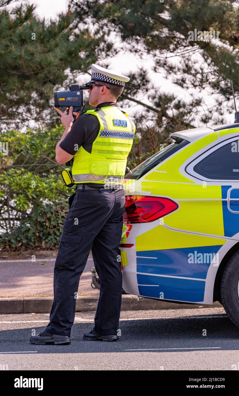 Police car looking dor speeding cars hi-res stock photography and images -  Alamy