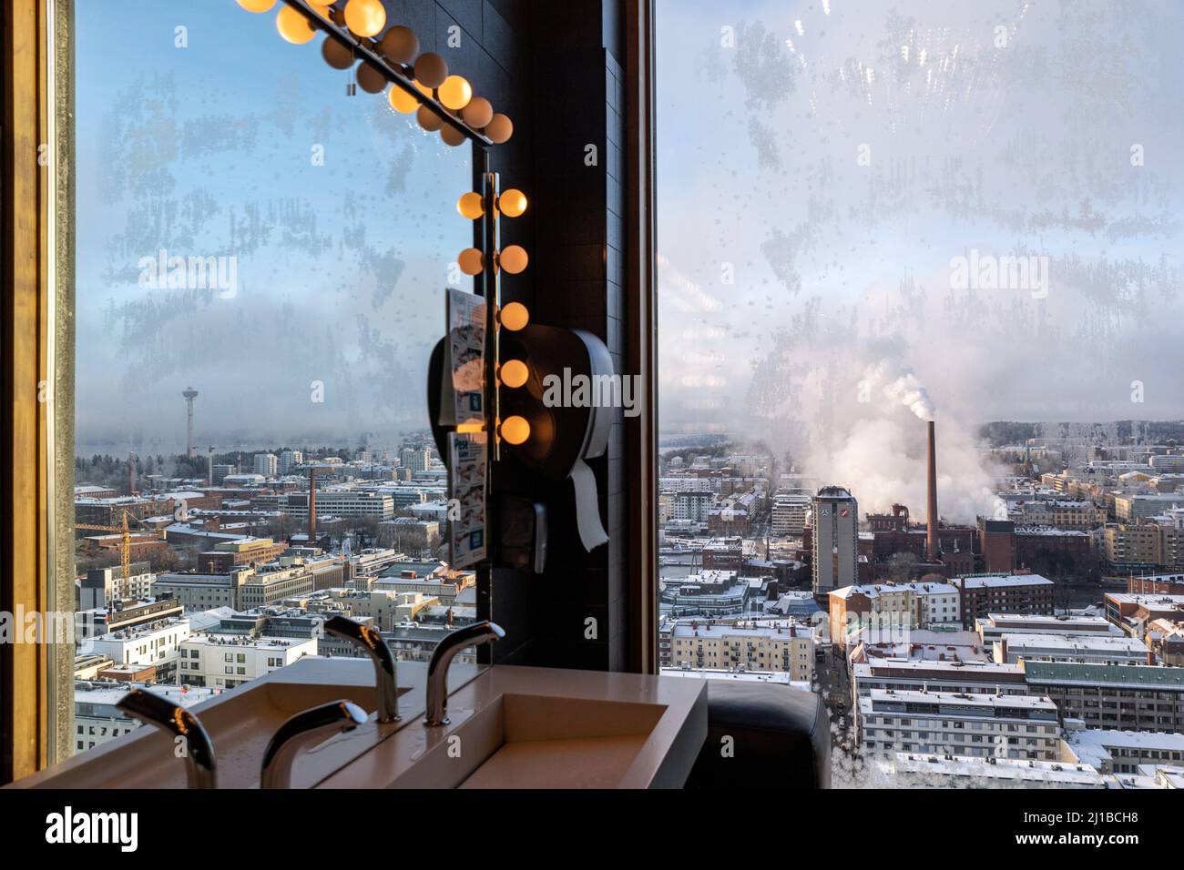 SMOKESTACK OF THE METSA BOARD TAKO PAPERBOARD FACTORY SEEN FROM THE RESTROOMS OF THE PANORAMIC MORO SKY BAR, TAMPERE, FINLAND, EUROPE Stock Photo