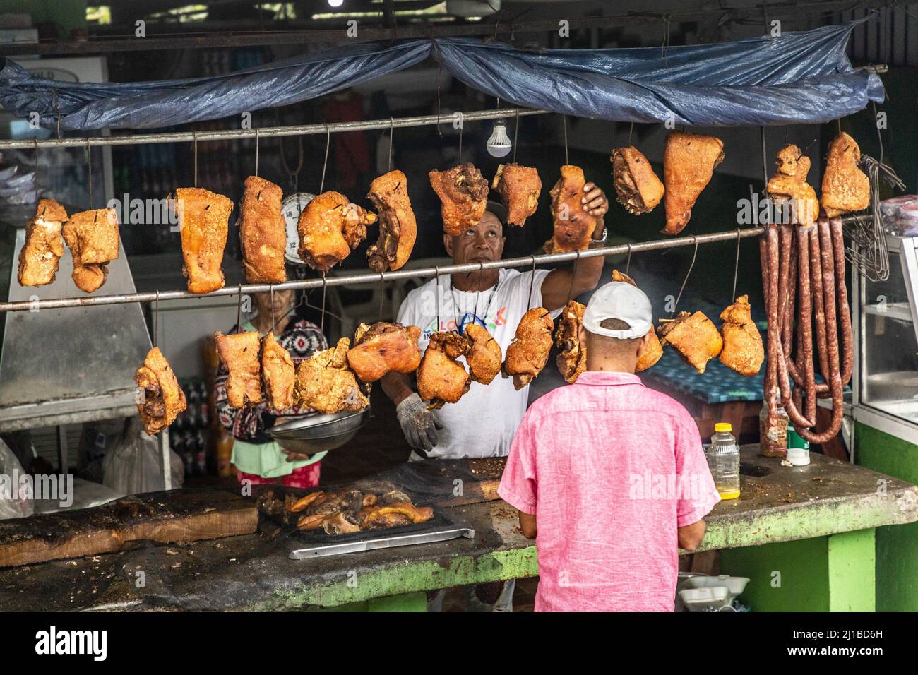 DRIED PORK VENDOR, CONCEPCION DE LA VEGA, DOMINICAN REPUBLIC Stock Photo