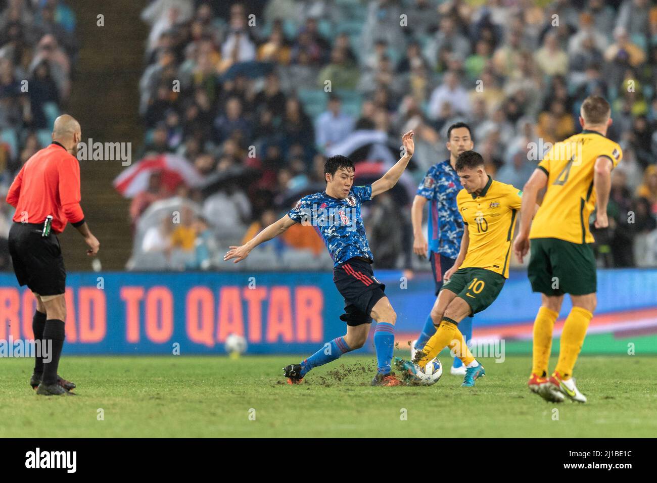Sydney, Australia. 24th Mar, 2022. Wataru Endo of Japan is challenged by Ajdin Hrustic of Australia during FIFA World Cup Qatar 2022 Qualification match between Australia and Japan at Stadium Australia in Sydney on March 24, 2022 in Sydney, Australia. ( Editorial use only ) Credit: Izhar Ahmed Khan/Alamy Live News/Alamy Live News Stock Photo