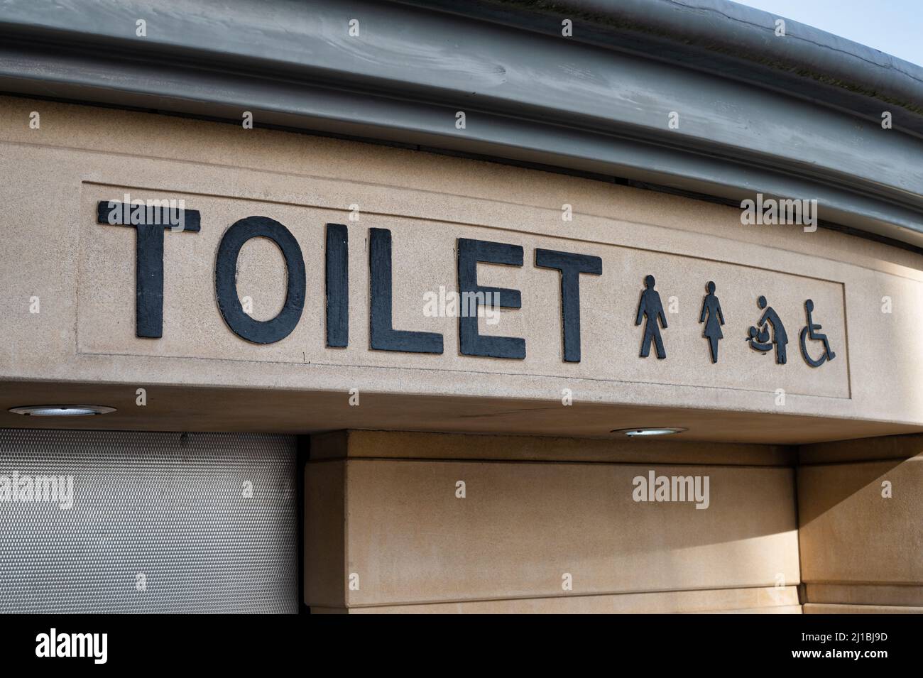 Sign for public toilets with a simble of a man, women, baby and disabled person Stock Photo