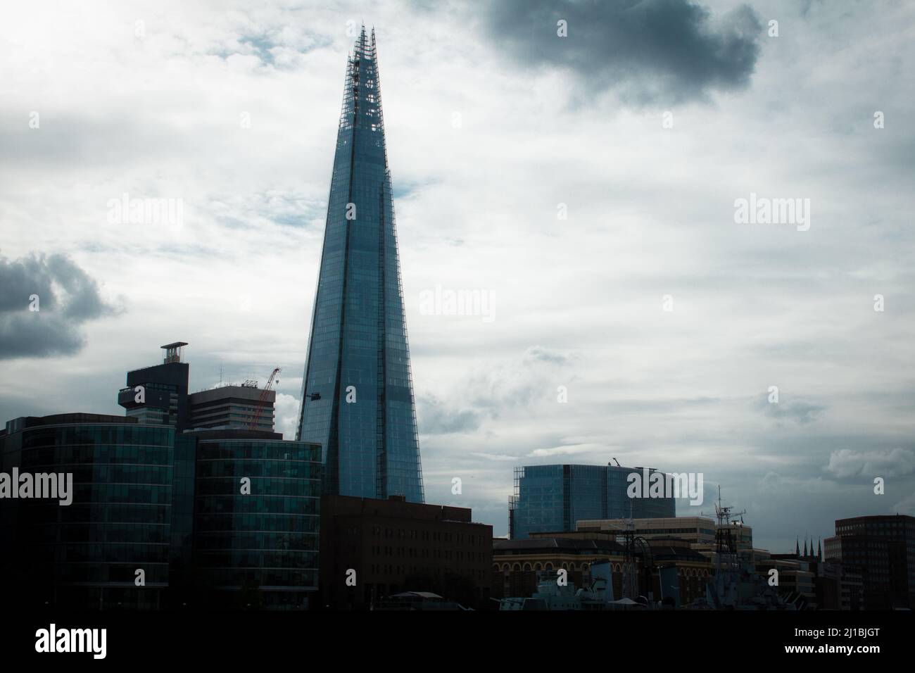 The famous Shard modern building against a cloudy sky in London Stock ...
