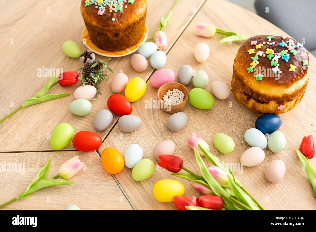 Easter cake and colorful eggs on festive Easter table Stock Photo
