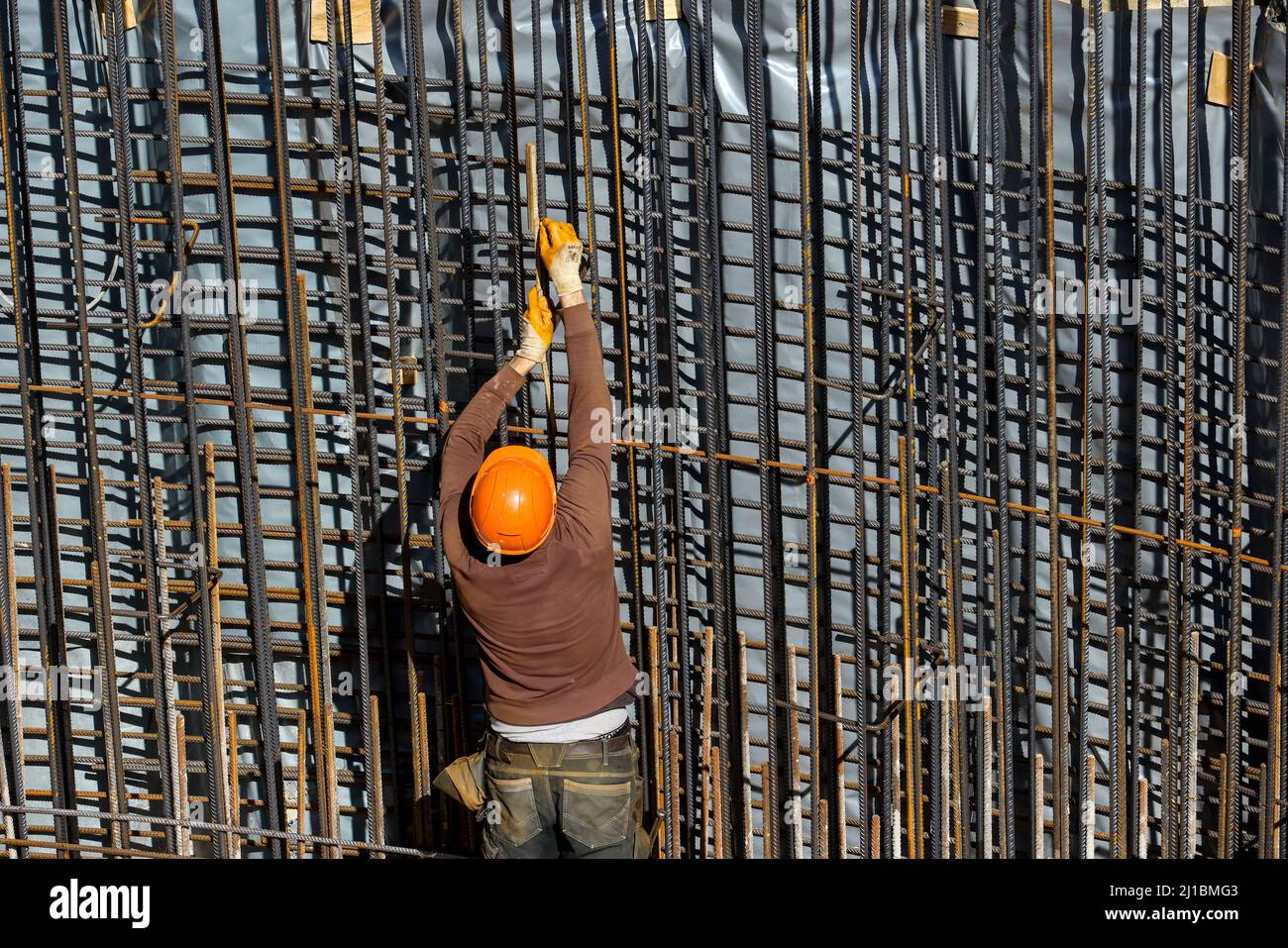 Essen, North Rhine-Westphalia, Germany - construction industry, construction workers work on a construction site. Iron trusses is a job title for cons Stock Photo