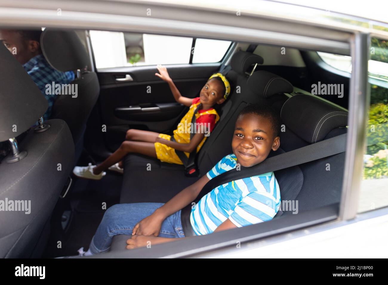 Portrait Of Smiling African American Brother And Sister With Seat Belts 