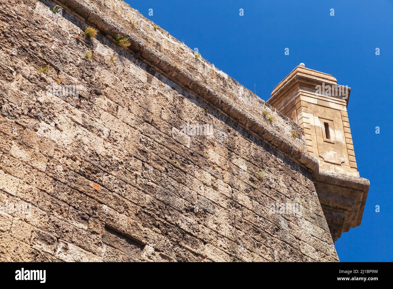 Ancient coastal fortification, stone wall and watch tower are under ...