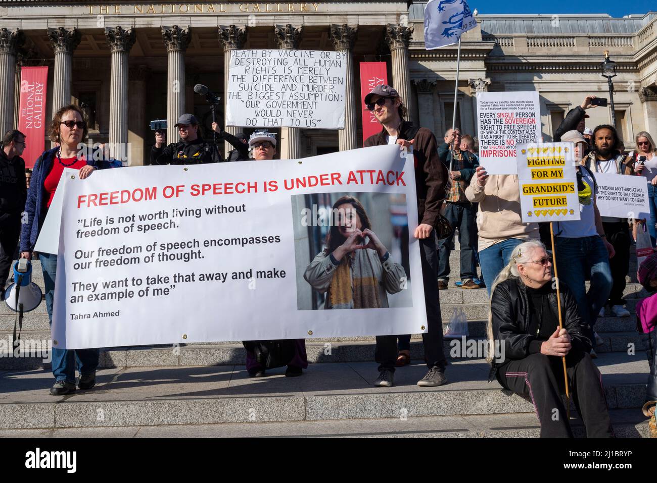 Freedom of speech protest against the online safety bill in London, UK. Banner quoting Tahra Ahmed, jailed for inciting race hate. Anti vax placards Stock Photo
